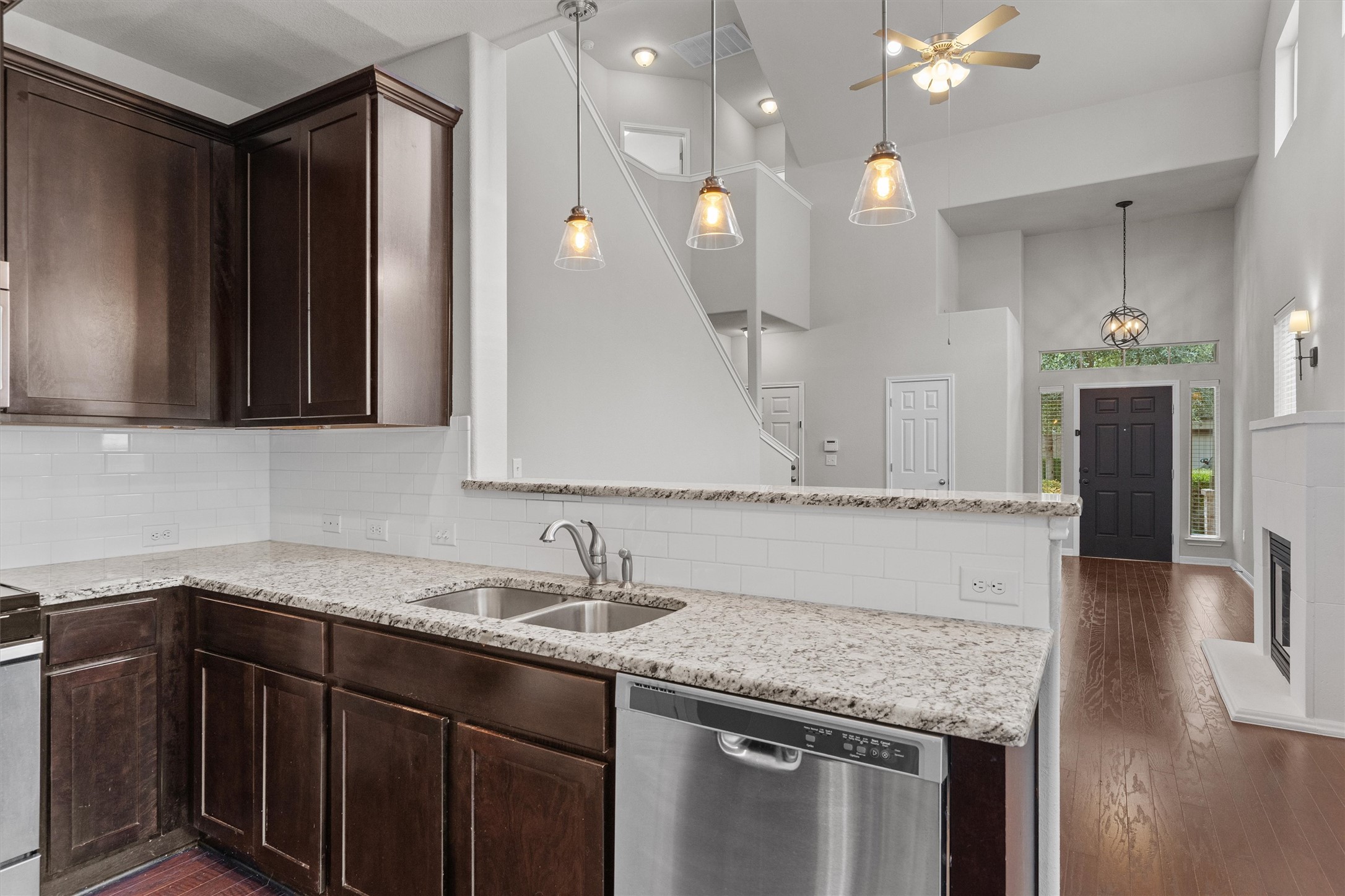 7709 Menchaca Road, Unit 22 Austin, TX 78745 - Photo 10 of 35 a kitchen with a sink cabinets and chandelier