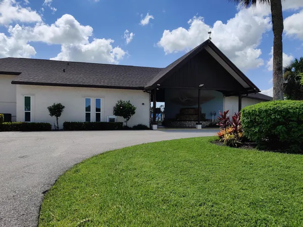 a group of people sitting in backyard of the house