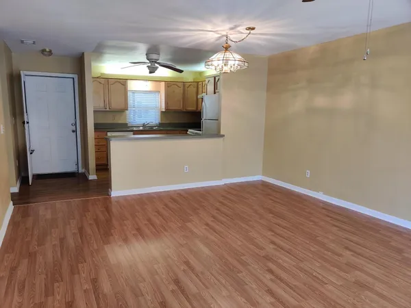 a view of a kitchen from the hallway