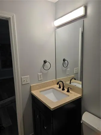 a bathroom with a sink and mirror