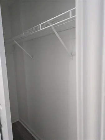 a view of an empty walk in closet