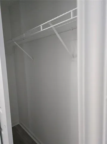 a view of an empty walk in closet