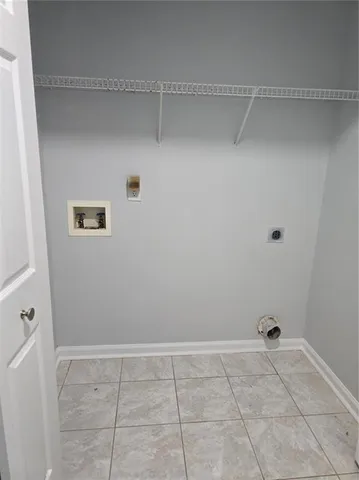 a view of a livingroom with racks on the wall