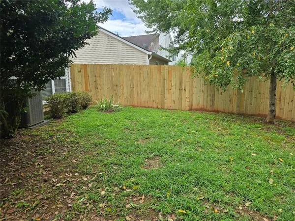 a view of a back yard of the house