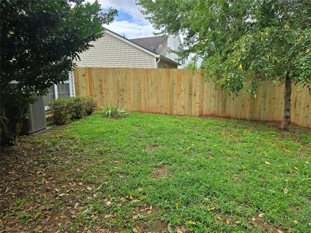 a view of a back yard of the house