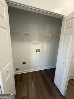 view of a room with wooden floor and white walls