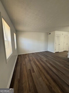 122 Saine Drive Southwest, Unit 307 Marietta, GA 30008 - Photo 15 of 22 a view of empty room with wooden floor and fan