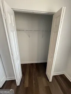 a view of front door with wooden floor