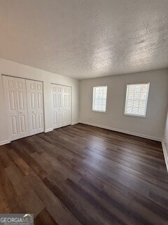 122 Saine Drive Southwest, Unit 307 Marietta, GA 30008 - Photo 19 of 22 a view of empty room with wooden floor and fan