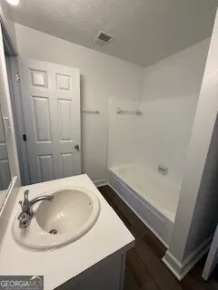 a bathroom with a sink and a tub