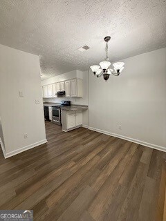 122 Saine Drive Southwest, Unit 307 Marietta, GA 30008 - Photo 6 of 22 a view of a kitchen with a sink cabinets and wooden floor