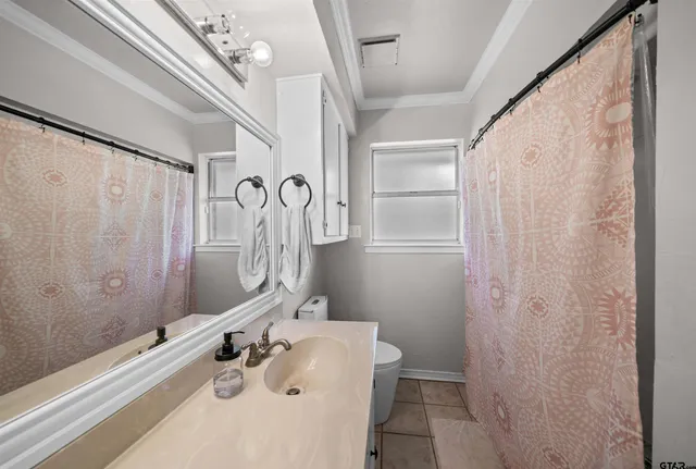 a bathroom with a sink a mirror and a shower