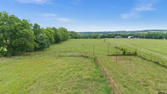 a aerial view of a house with a yard