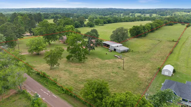 a view of a lake with a yard