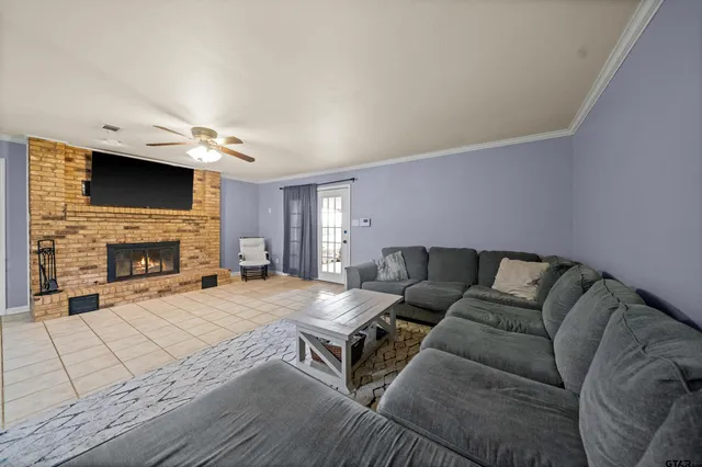 a living room with furniture and a fireplace