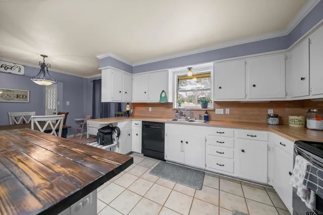 a kitchen with cabinets and window