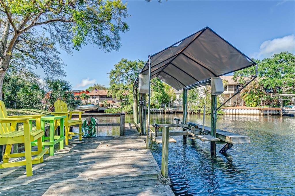 4854 Blue Jay Circle Palm Harbor, FL 34683 - Photo 1 of 1 a view of a swimming pool with a patio