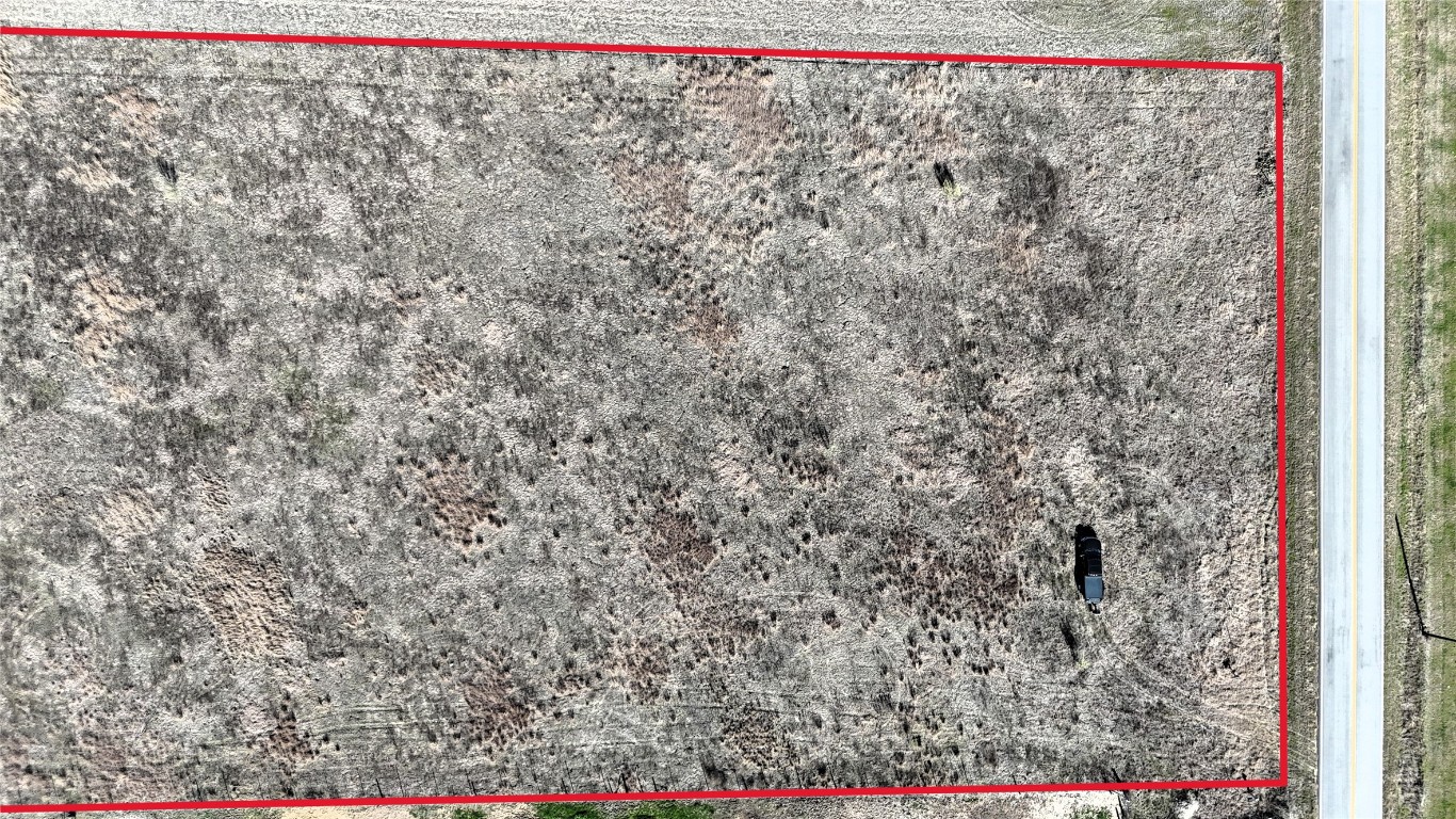 16024 Wells Road Manor, TX 78653 - Photo 11 of 14 a view of a dry yard