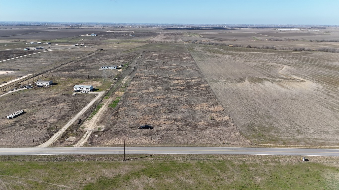 16024 Wells Road Manor, TX 78653 - Photo 4 of 14 a view of a yard with an ocean beach