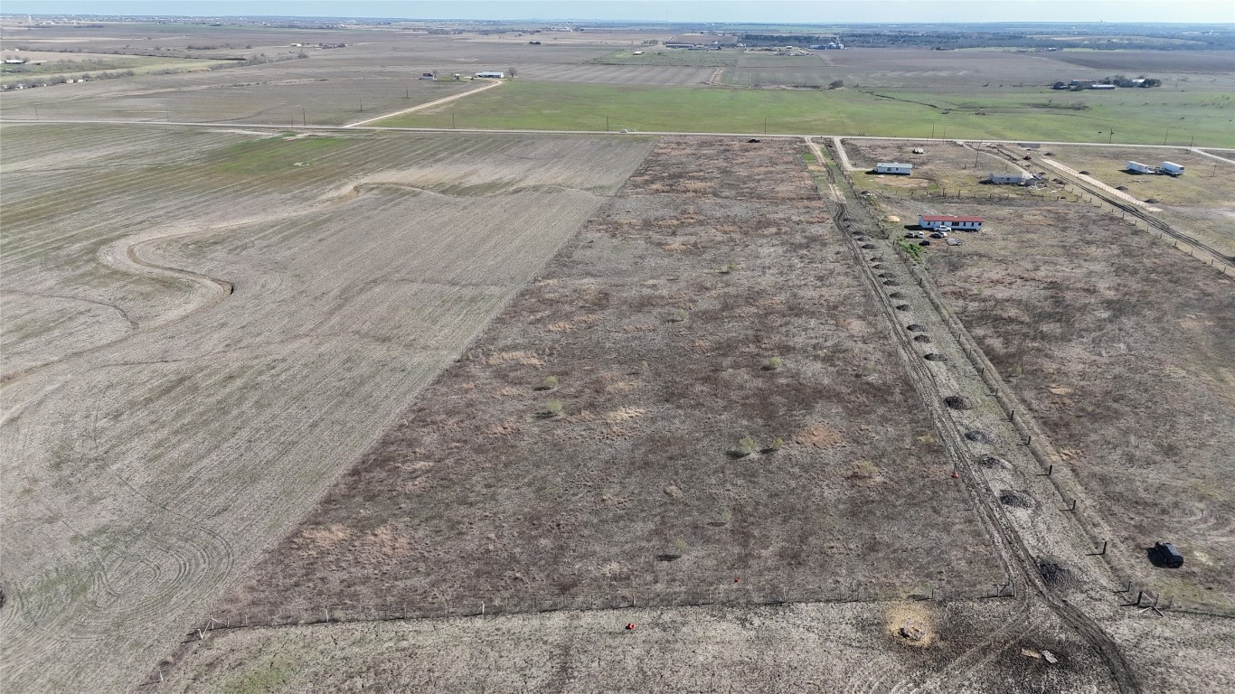 16024 Wells Road Manor, TX 78653 - Photo 8 of 14 a view of a road with an outdoor space