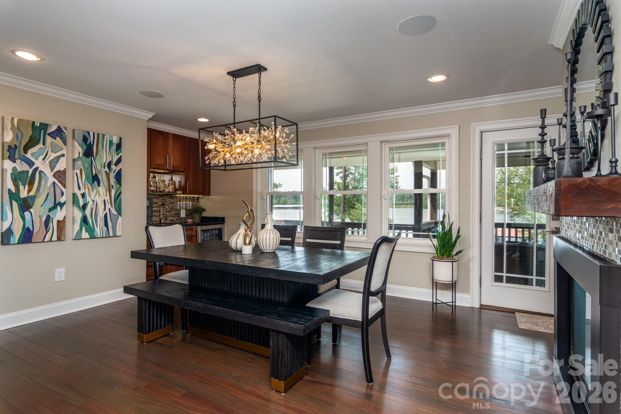 7144 Lynbrook Creek Road Denver, NC 28037 - Photo 11 of 47 a view of a dining room with furniture window and wooden floor