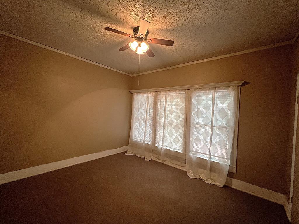 311 West Spring Street Weatherford, TX 76086 - Photo 12 of 15 a view of an empty room with a window
