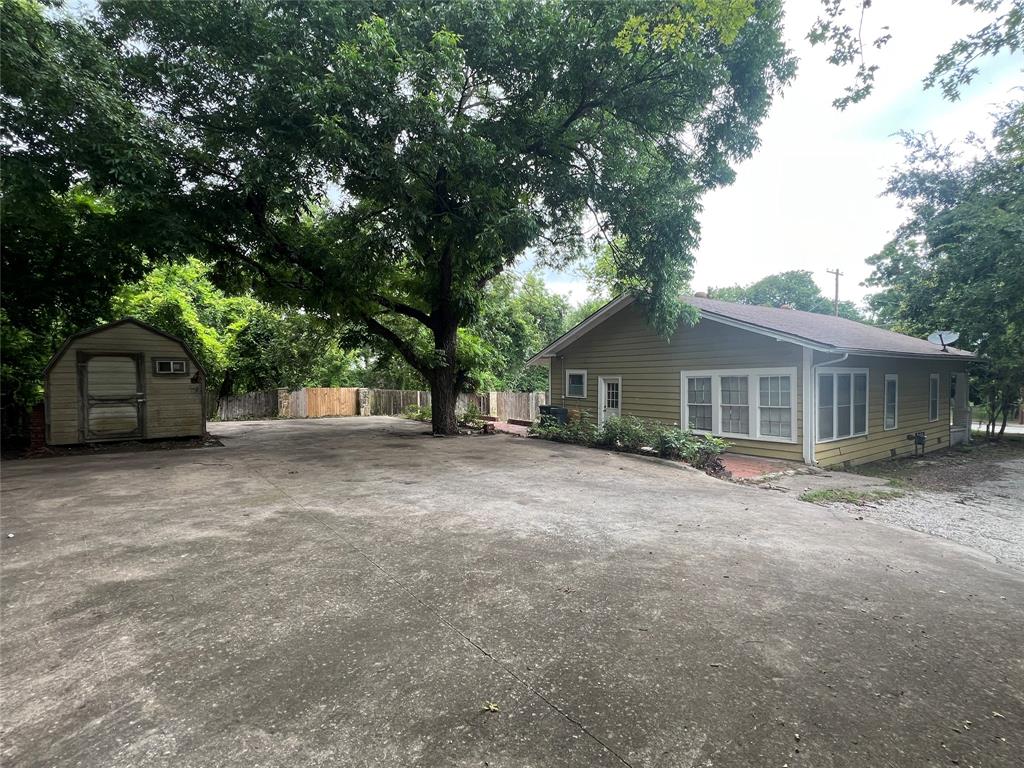 311 West Spring Street Weatherford, TX 76086 - Photo 15 of 15 a view of a house with a tree in front of it