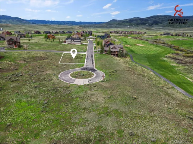 a view of a table and chairs in the garden