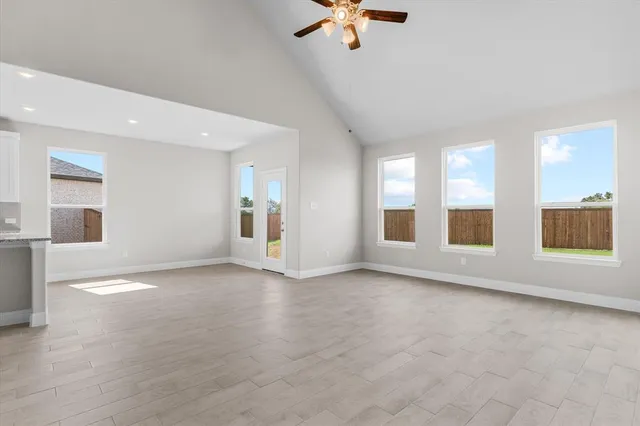 an empty room with a empty space and windows