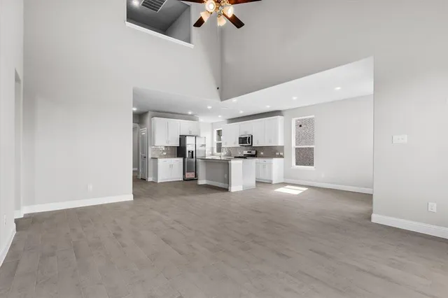 a view of a kitchen with a sink and cabinet area