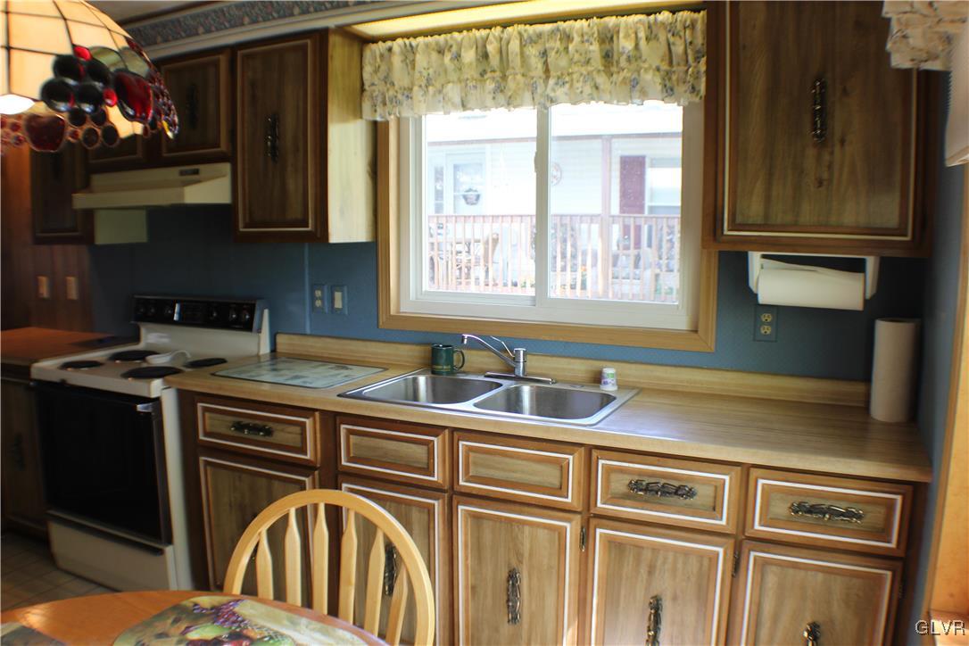 7 Springridge Road Bath, PA 18014 - Photo 7 of 17 a kitchen with stainless steel appliances granite countertop a sink and a stove