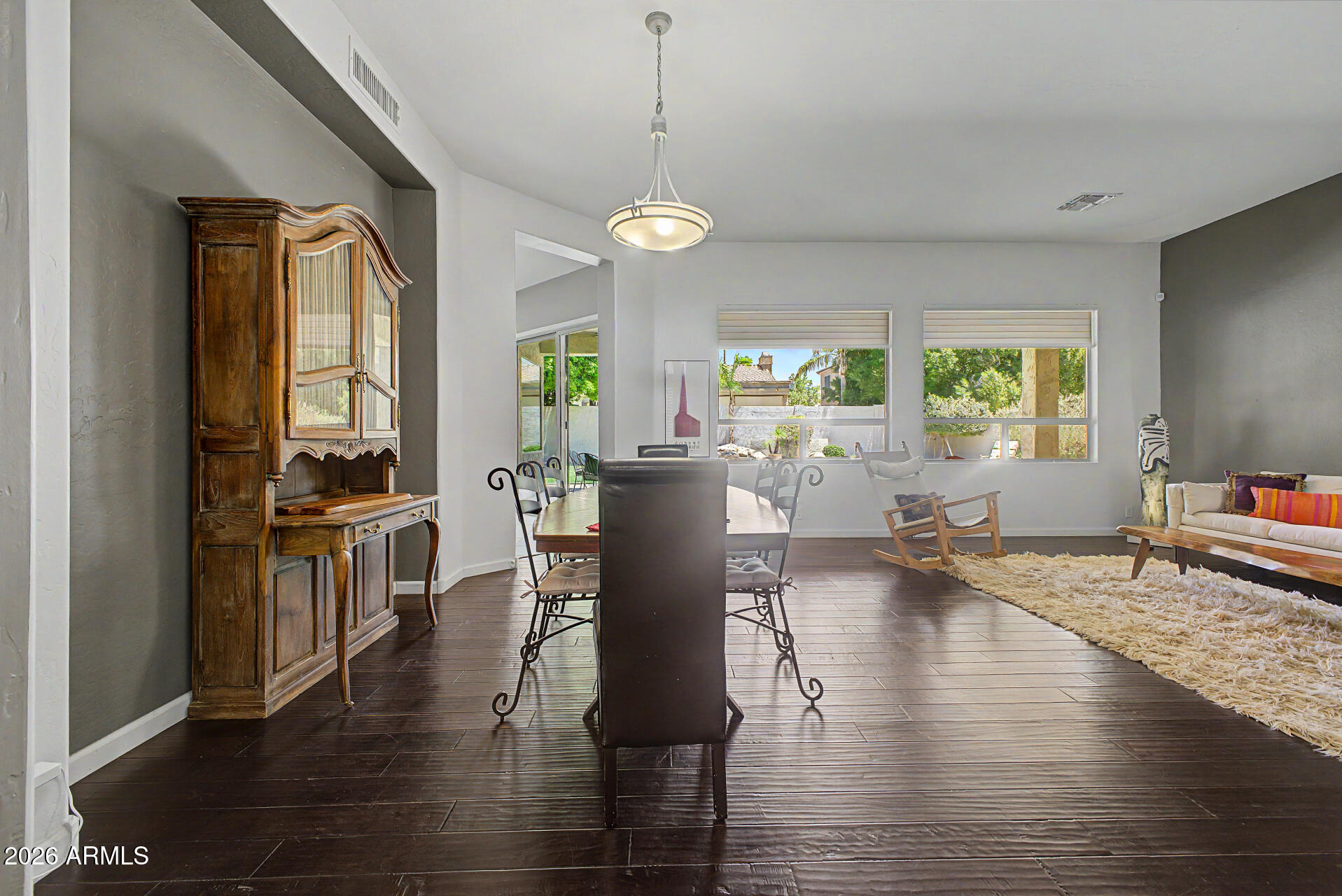 1632 West Frye Road Phoenix, AZ 85045 - Photo 9 of 37 a view of a dining room with furniture window and wooden floor