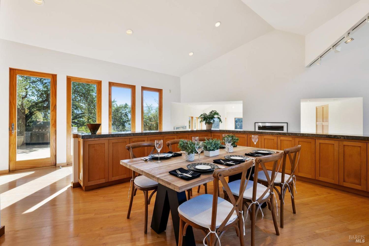10300 Slattery Road Kenwood, CA 95452 - Photo 15 of 35 a view of a dining room with furniture large windows and wooden floor