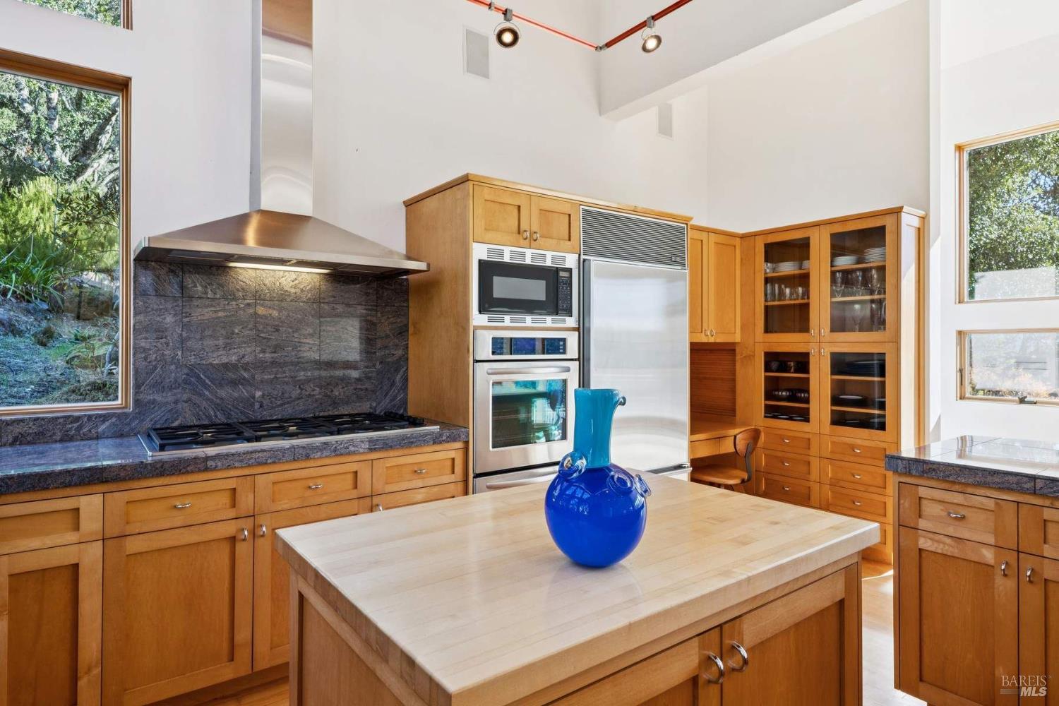 10300 Slattery Road Kenwood, CA 95452 - Photo 19 of 35 a kitchen with a sink a stove and a wooden cabinets