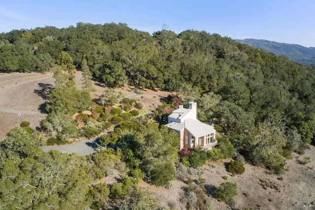 a view of a house with a window and a yard