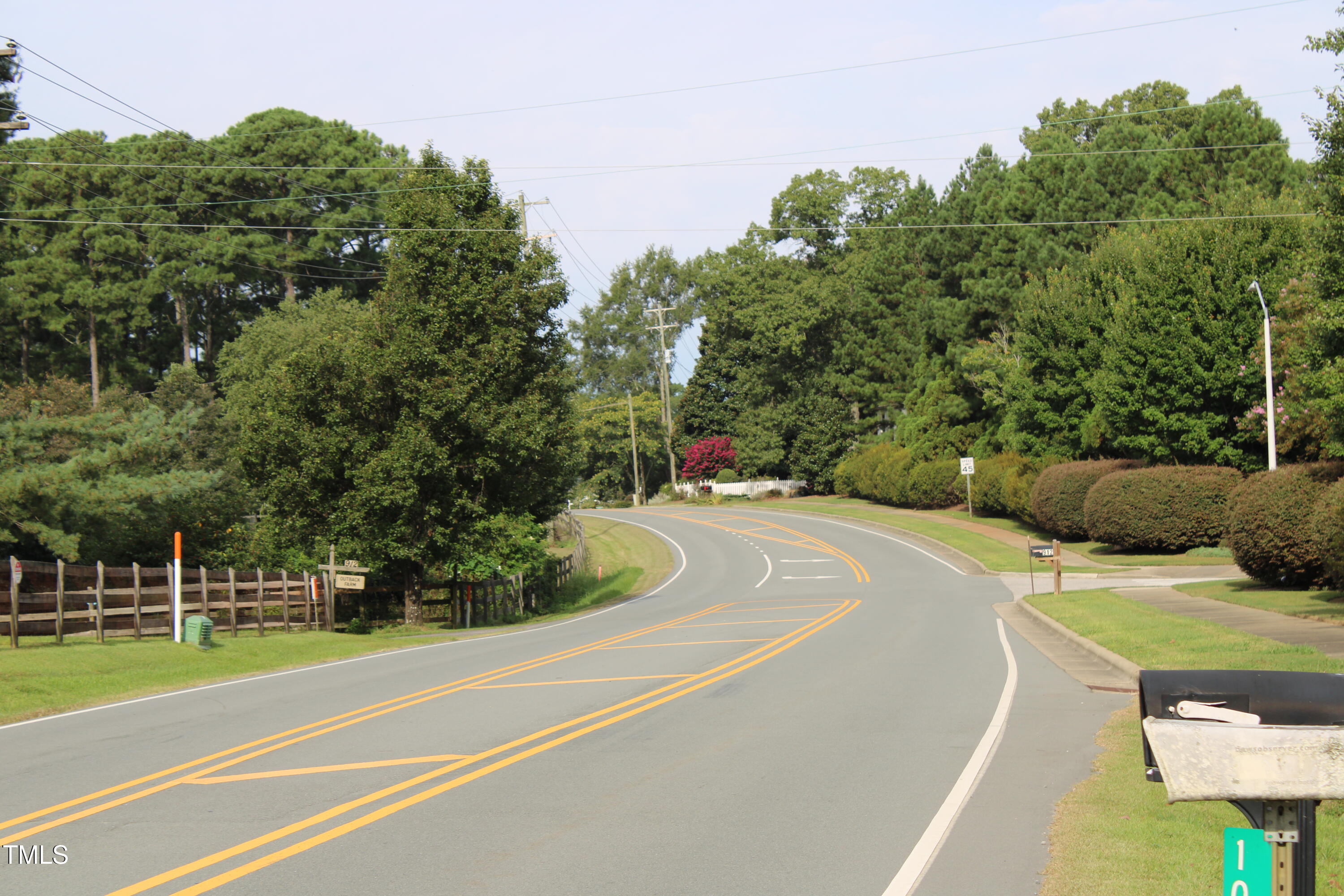 1103 Holland Road Fuquay-Varina, NC 27526 - Photo 6 of 10 a view of a tennis ground with large trees