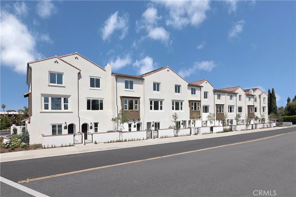 7363 Suva Street Downey, CA 90240 - Photo 1 of 13 a view of building with view of street