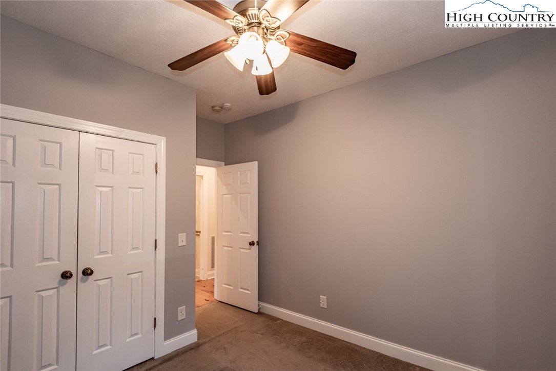 1195 Long Branch Road Lansing, NC 28643 - Photo 20 of 31 wooden floor in an empty room