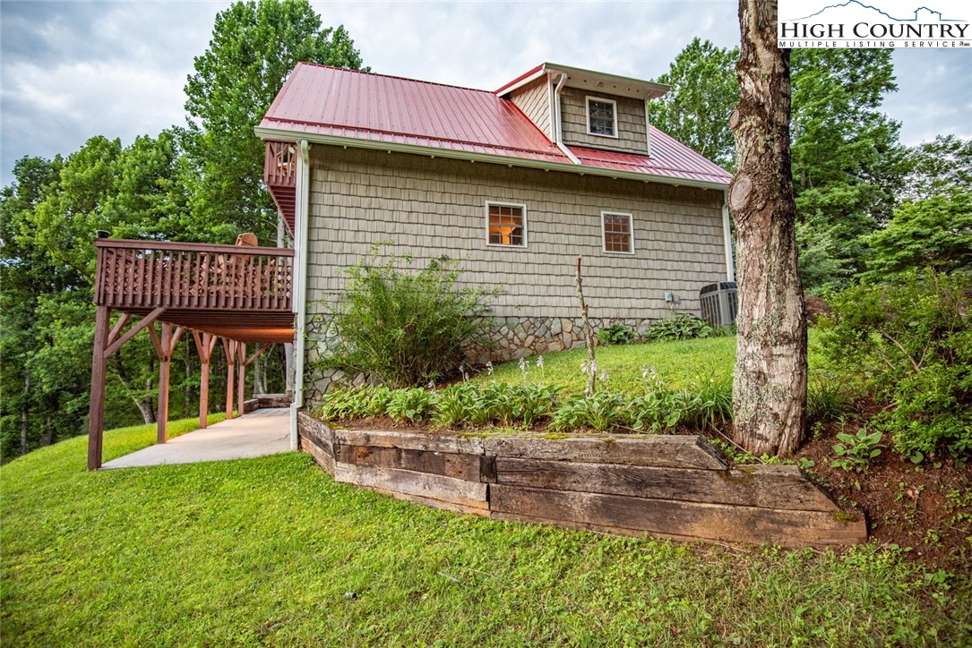 1195 Long Branch Road Lansing, NC 28643 - Photo 21 of 31 a view of a house with a yard