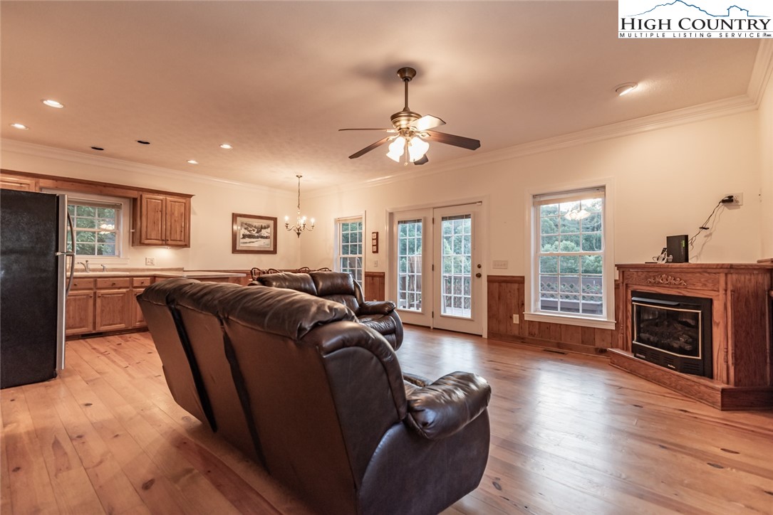 1195 Long Branch Road Lansing, NC 28643 - Photo 22 of 31 a living room with furniture and a fireplace