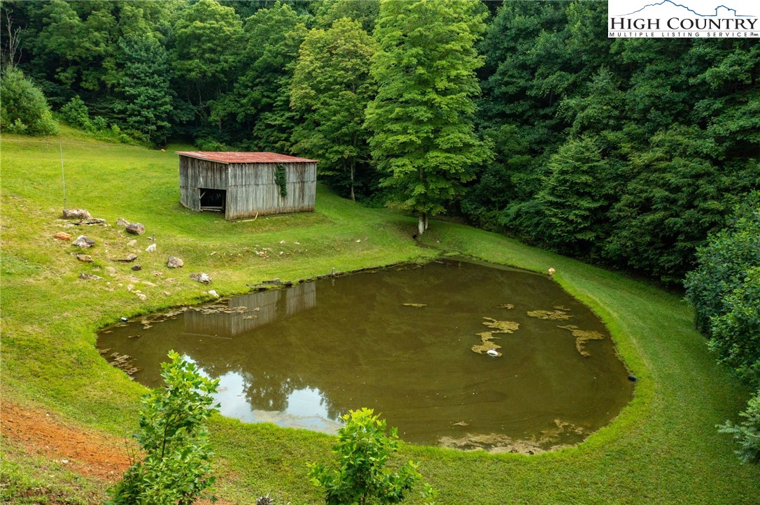 1195 Long Branch Road Lansing, NC 28643 - Photo 24 of 31 a view of a swimming pool with a yard