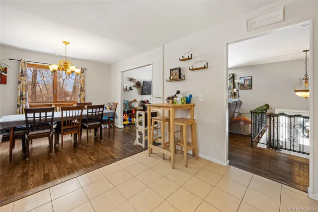 a view of a dining room with furniture and chandelier floor