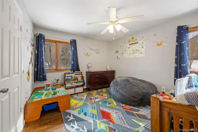 a bedroom with furniture and a window