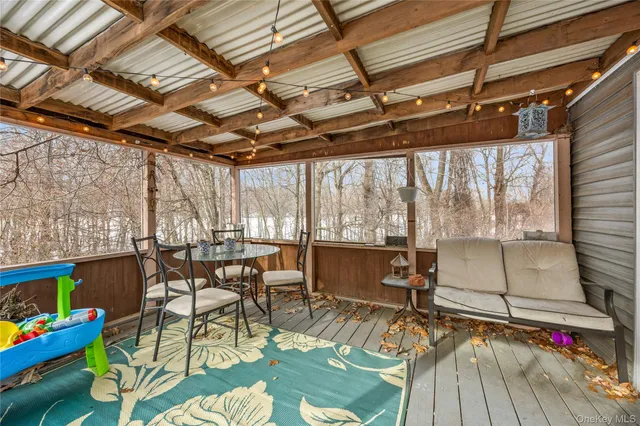 a room with lots of furniture and a large window