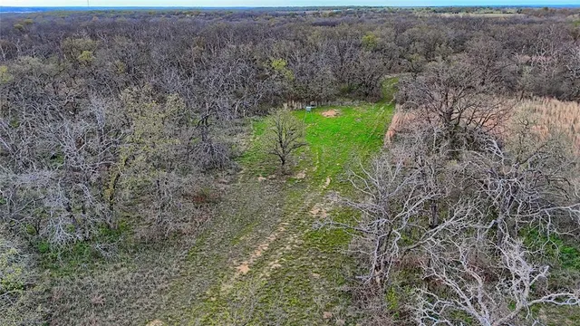 a view of a lake with houses in the back