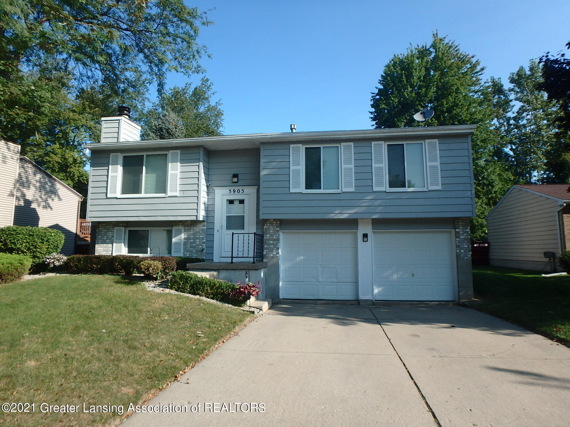 5905 Rockingham Drive Lansing, MI 48911 - Photo 1 of 30 Front