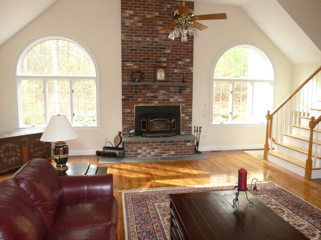 175 Robinson Road Boxborough, MA 01719 - Photo 12 of 30 a living room with furniture and a fireplace