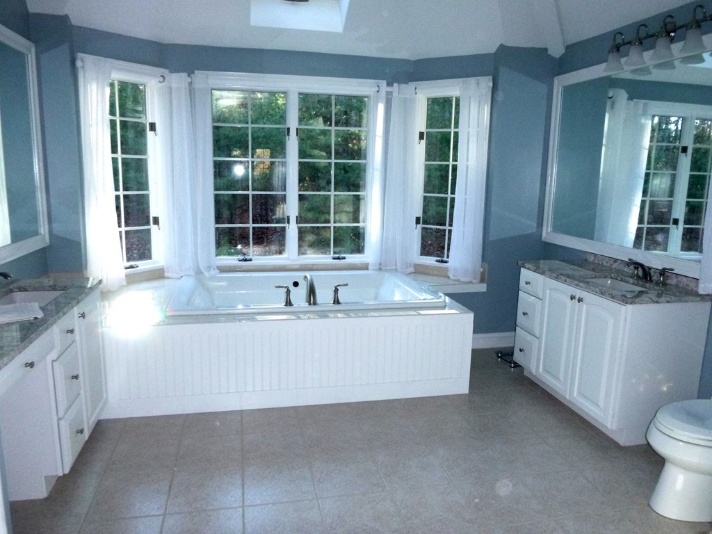 175 Robinson Road Boxborough, MA 01719 - Photo 17 of 30 a large white tub sitting in a bathroom
