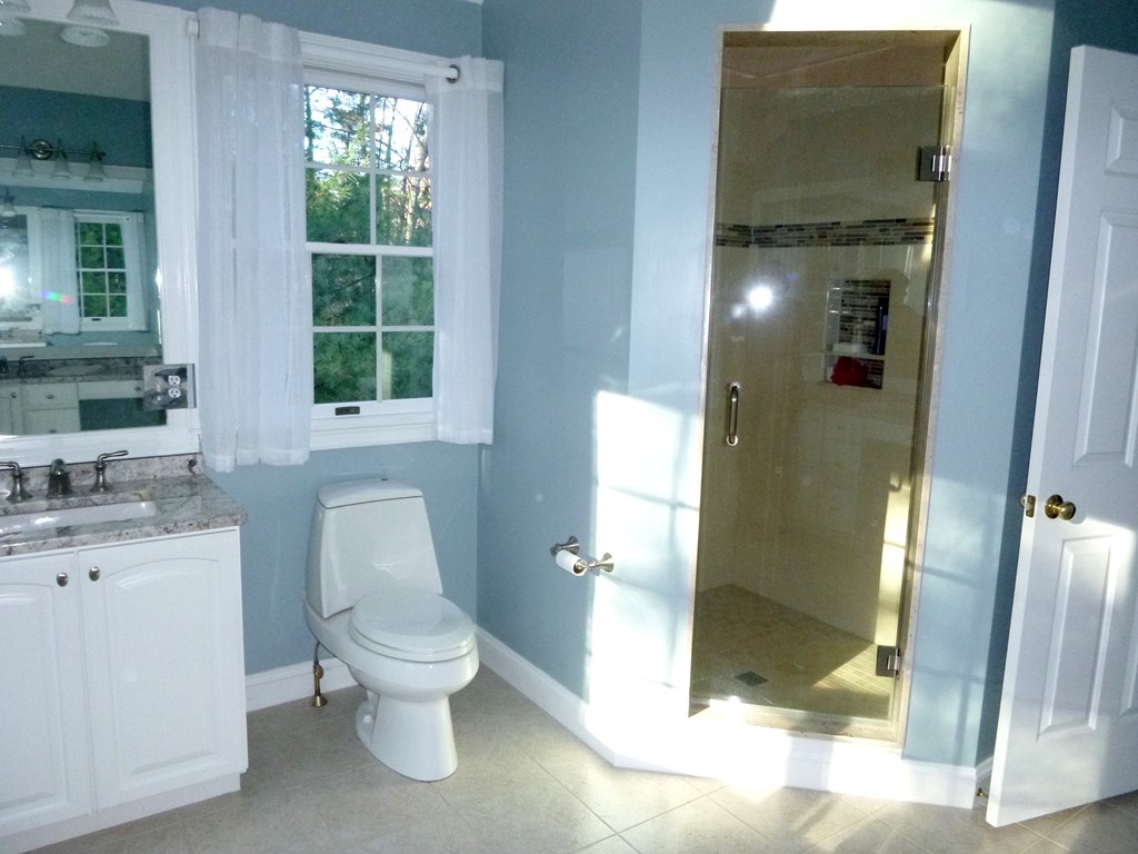 175 Robinson Road Boxborough, MA 01719 - Photo 18 of 30 a white toilet sitting next to a bathroom sink