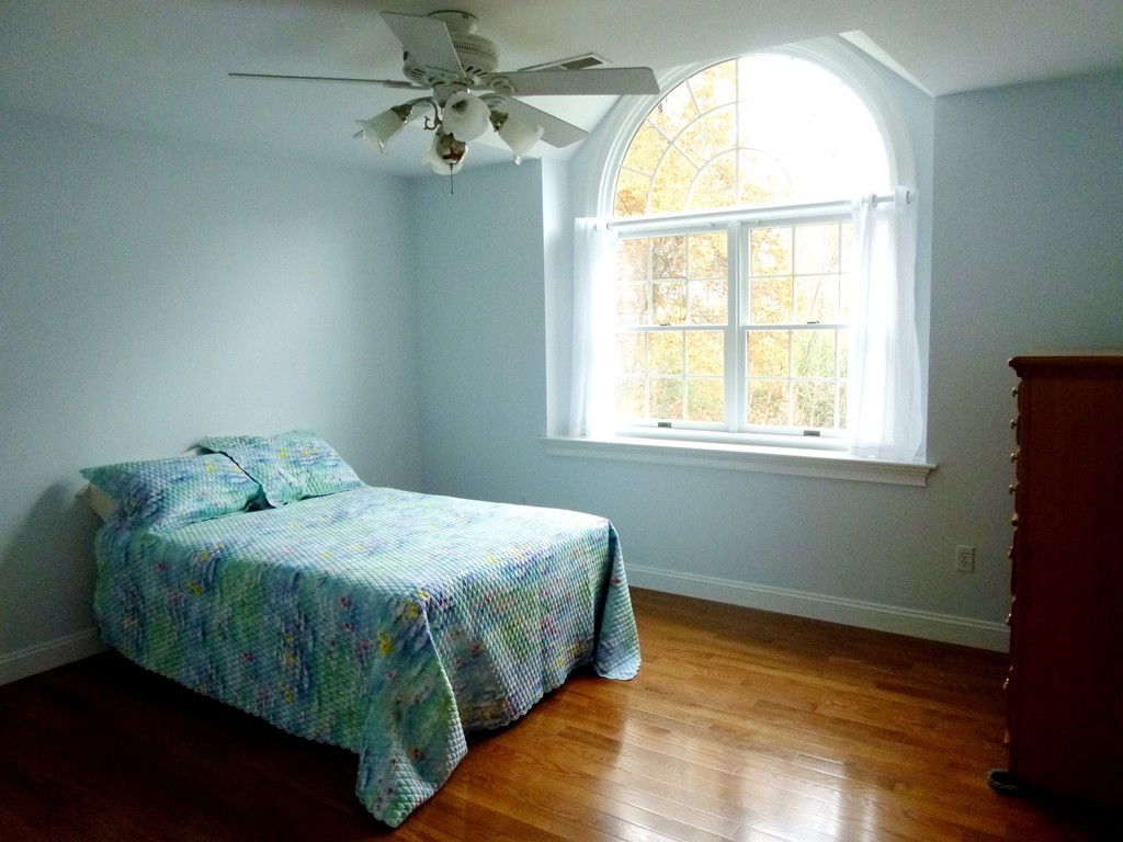 175 Robinson Road Boxborough, MA 01719 - Photo 19 of 30 a bedroom with a bed and a window